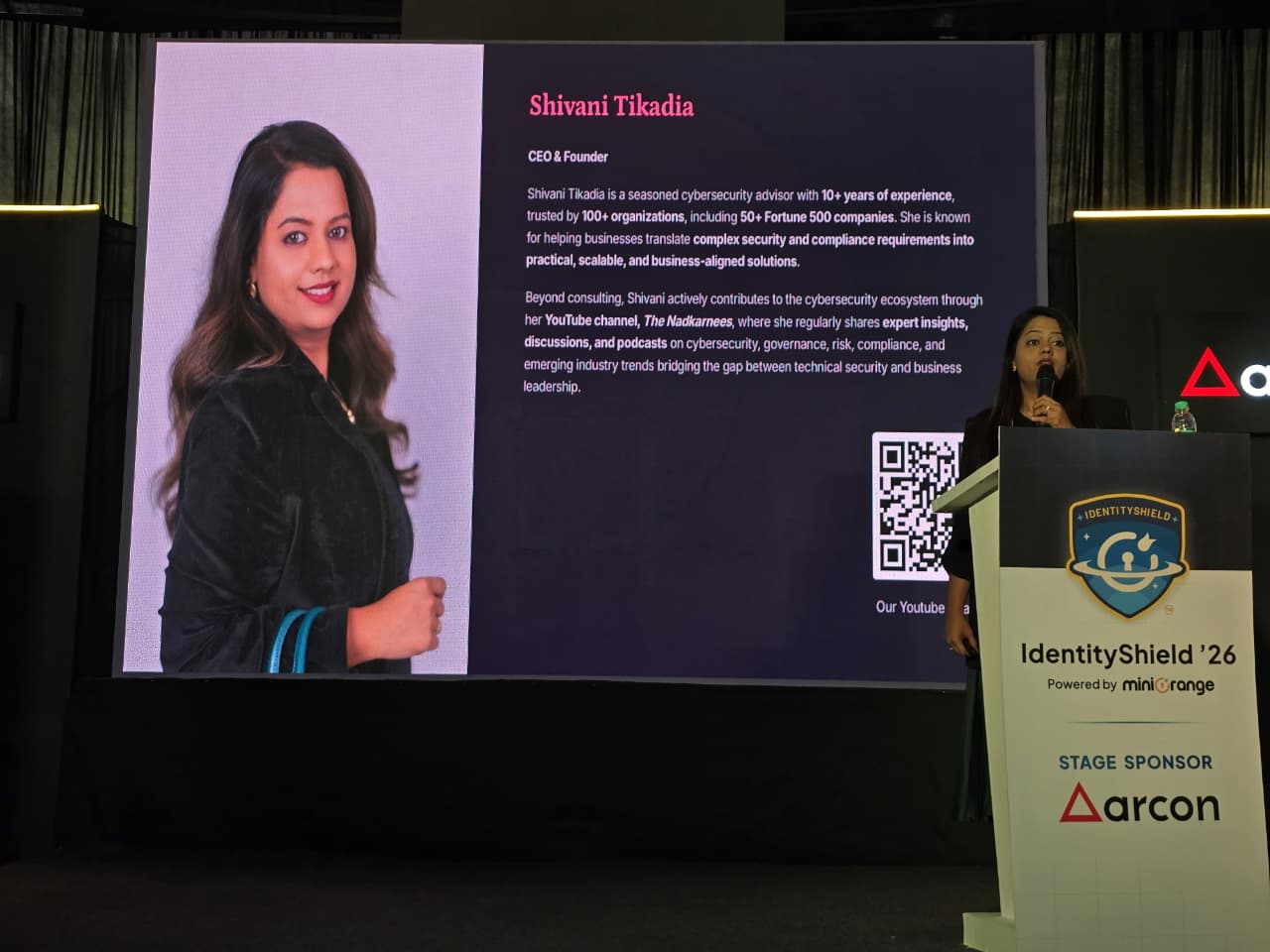 SecComply booth with client testimonials on display