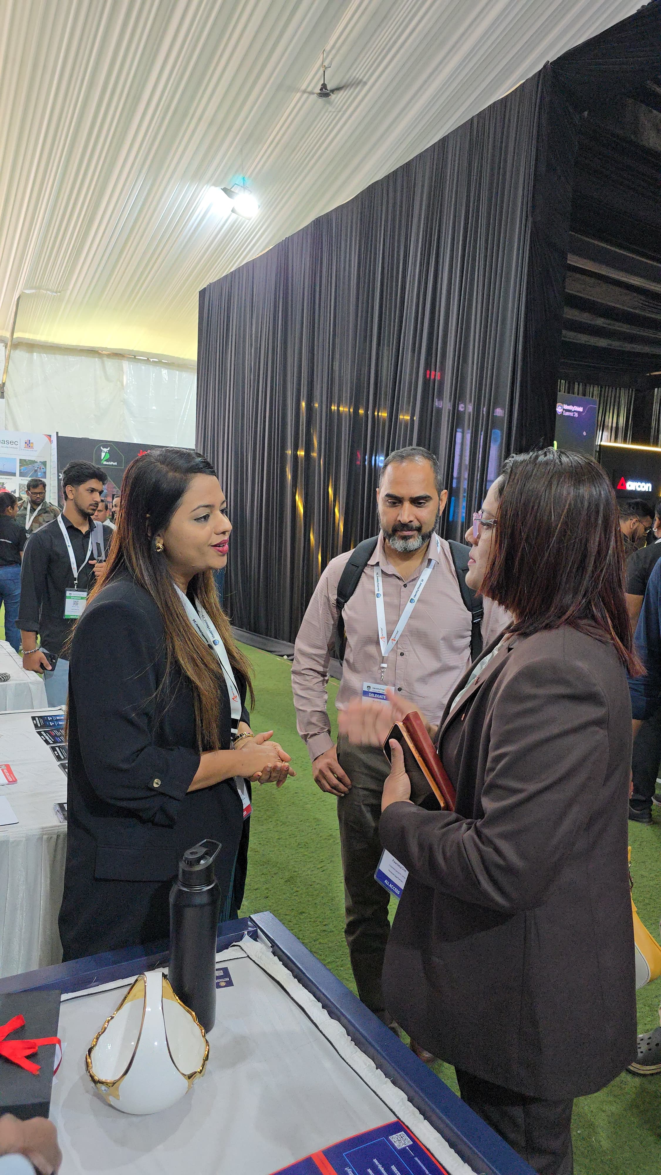Shivani in conversation with delegates at the SecComply booth