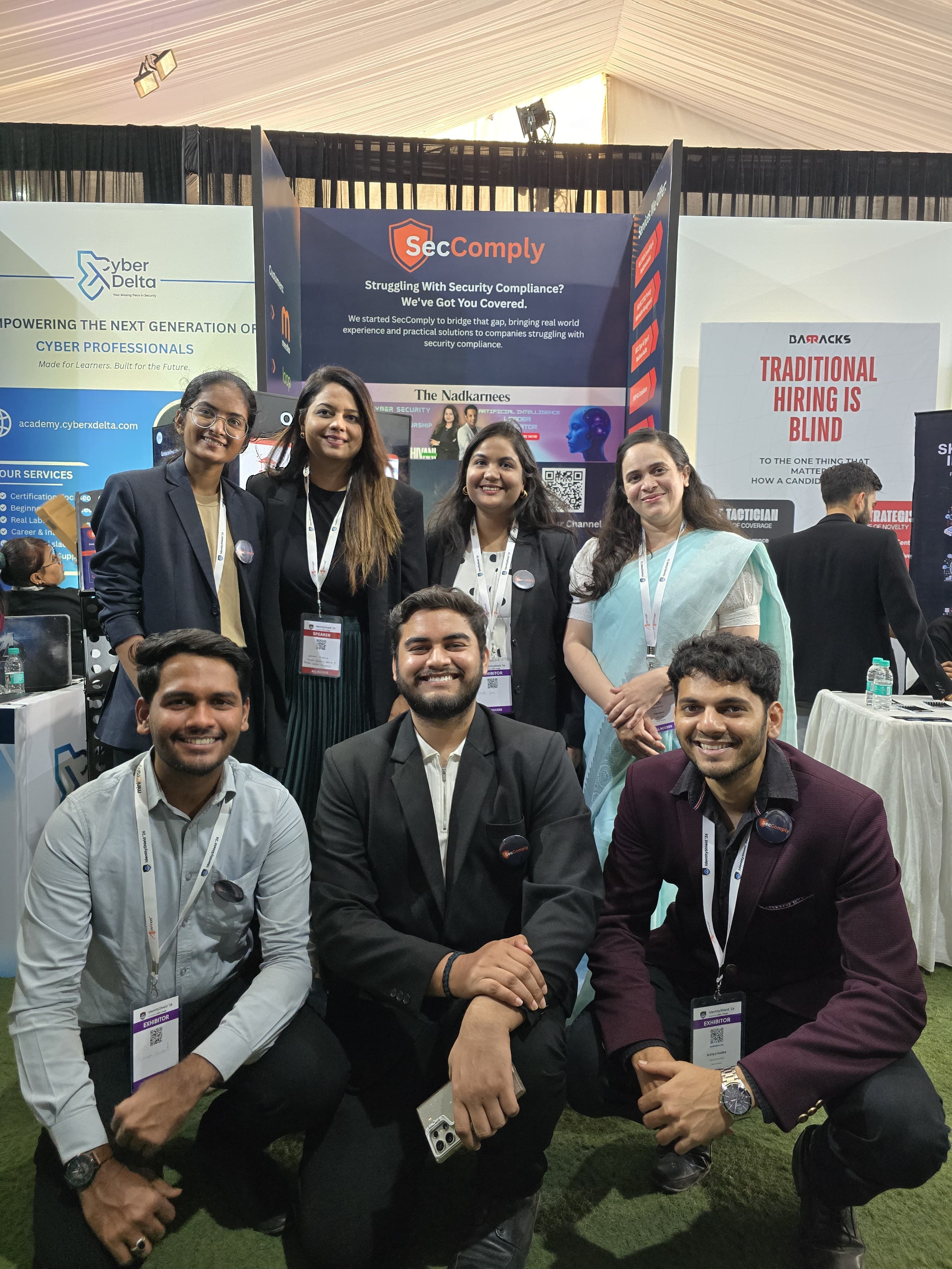 SecComply team at the booth — full lineup