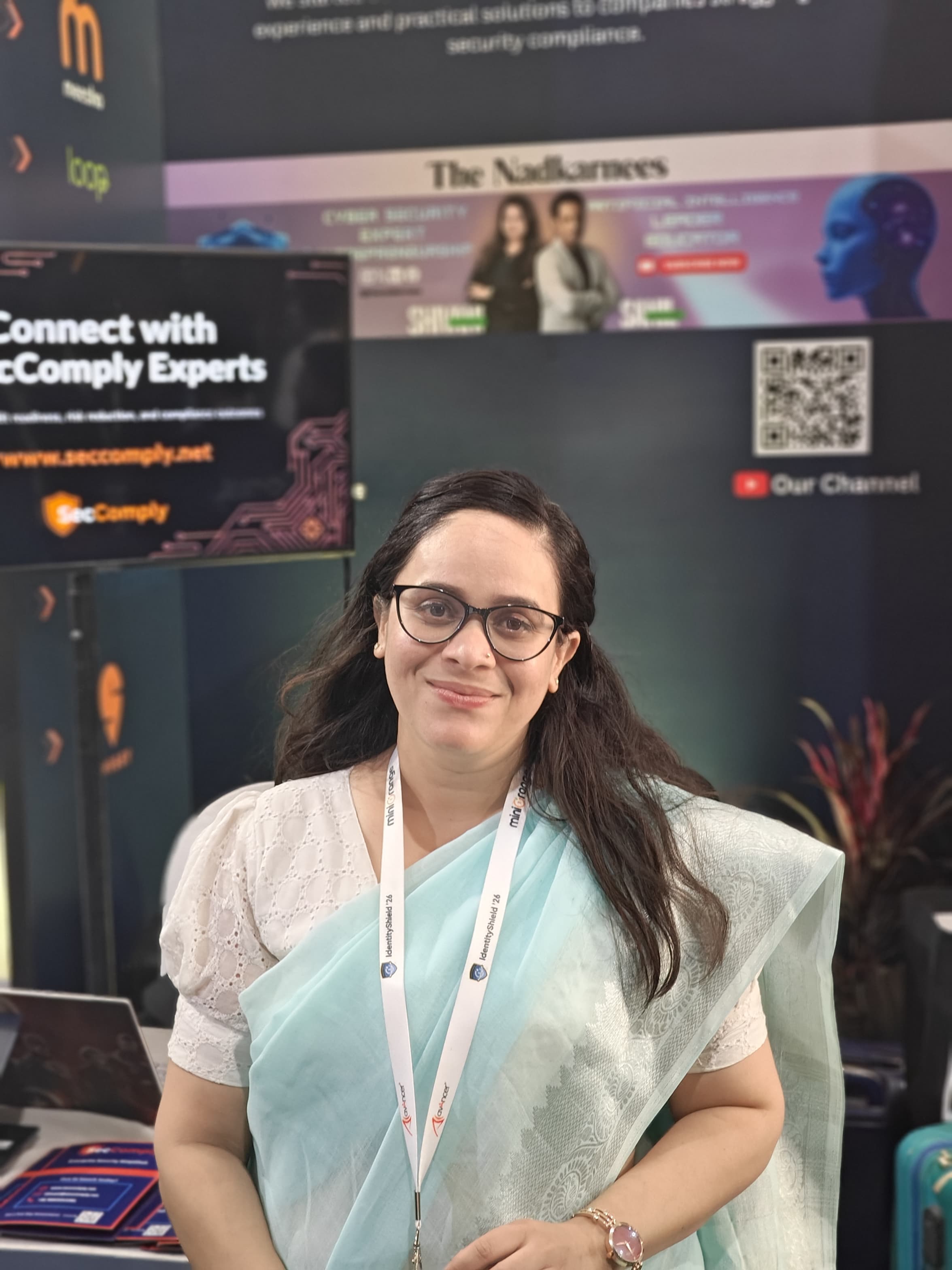 SecComply team member at the booth