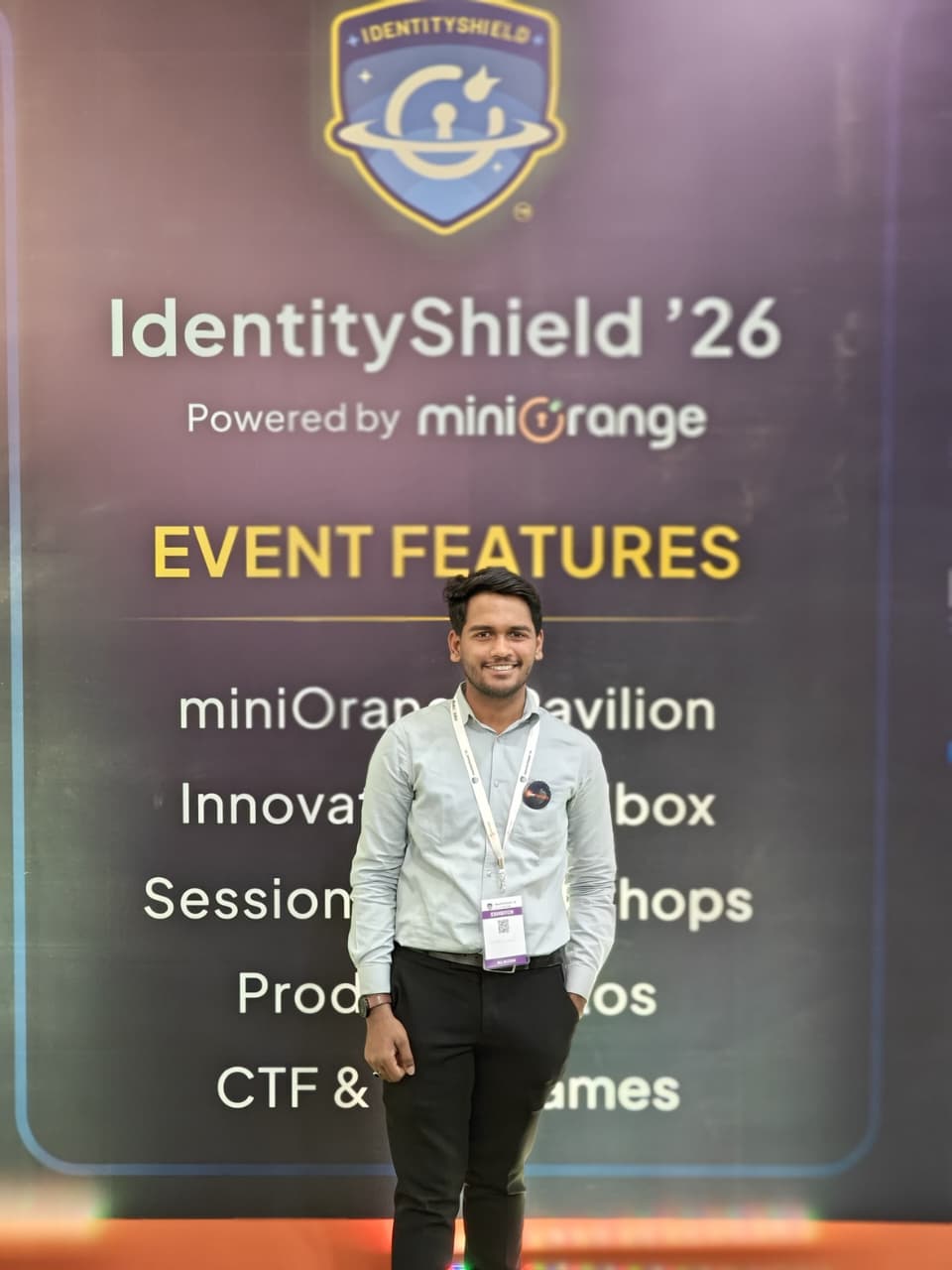 SecComply team member at the event features wall