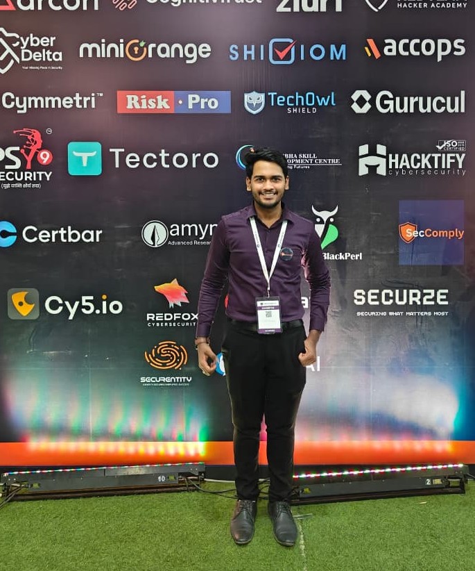 SecComply team member at the sponsor wall